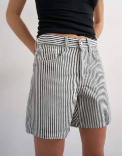 Model wearing Denim Editor short in ecru stripe