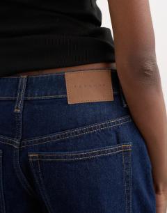 Model wearing Denim Editor short in indigo rinse