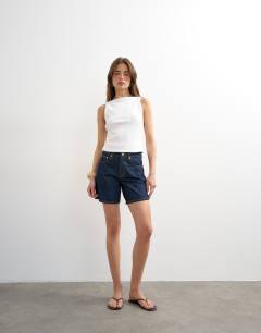 Model wearing Denim Editor short in indigo rinse