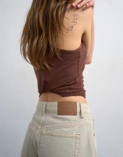 Model wearing Denim Editor short in oat