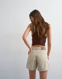 Model wearing Denim Editor short in oat