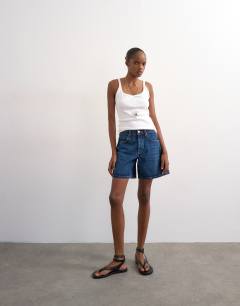Model wearing Denim Editor short in rich blue