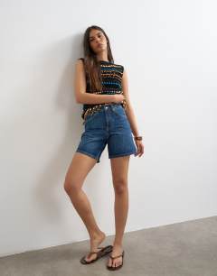 Model wearing Denim Editor short in rich blue