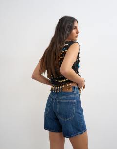 Model wearing Denim Editor short in rich blue