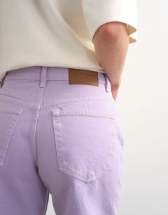 Model wearing Denim Editor shorts in lilac