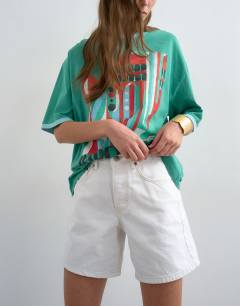 Model wearing Denim Editor shorts in white