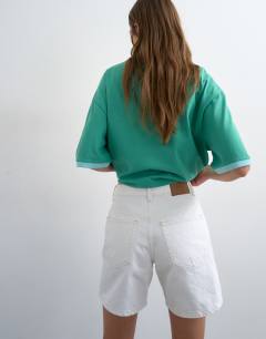 Model wearing Denim Editor shorts in white