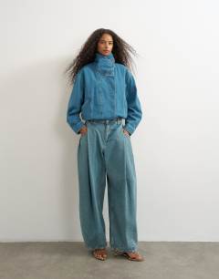 Model wearing Denim elastic waistband bomber jacket in mid green cast 