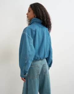 Model wearing Denim elastic waistband bomber jacket in mid green cast 