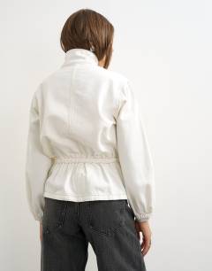 Model wearing Denim elasticated waist funnel sporty track jacket in bone