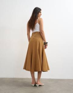 Model wearing Denim fit and flare maxi skirt in tobacco
