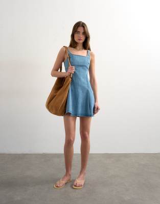 Denim flippy seamed pleat hem mini dress in bleach