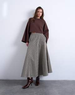 Model wearing Denim full circle maxi skirt in brown stripe