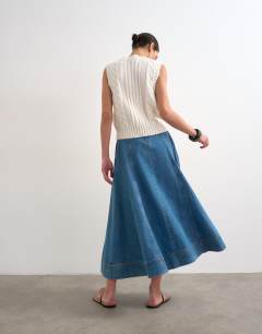Model wearing Denim full maxi skirt in mid blue