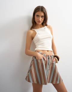 Model wearing Denim full pleated mini skirt in stripe