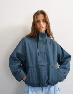 Model wearing Denim funnel neck bubble hem top in sulphur blue