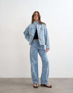 Model wearing Denim funnel neck elastic hem detail jacket ultra-distressed bleach