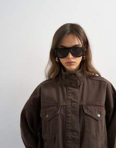 Model wearing Denim funnel neck jacket with waist detail in chocolate