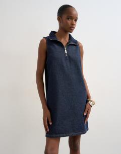 Model wearing Denim funnel neck pinny dress blue rinse