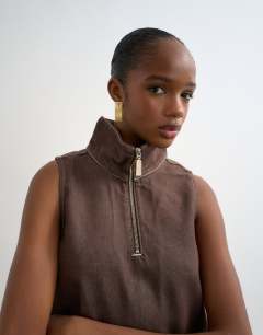 Model wearing Denim funnel neck pinny dress choc rinse