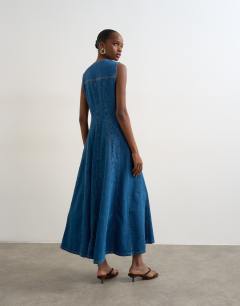 Model wearing Denim godet seam maxi dress in rich blue