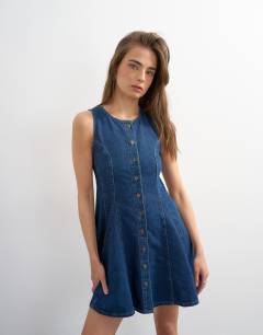 Model wearing Denim godet seam mini dress in rich blue