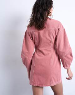 Model wearing Denim high neck button through shirt dress in pink