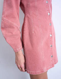 Model wearing Denim high neck button through shirt dress in pink