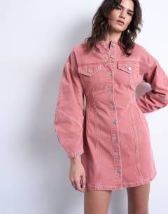 Model wearing Denim high neck button through shirt dress in pink