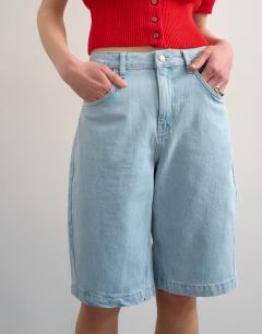 Model wearing Denim longline short in bleach