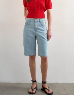 Model wearing Denim longline short in bleach