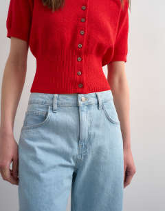 Model wearing Denim longline short in bleach