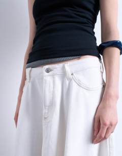 Model wearing Denim maxi full circle skirt in ecru