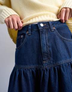 Model wearing Denim maxi skirt with gathered yoke detail in rich blue