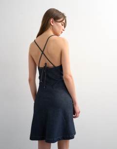 Model wearing Denim mini cami swing dress in indigo rinse