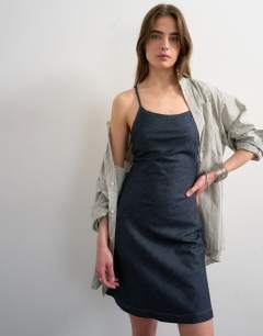 Model wearing Denim mini cami swing dress in indigo rinse