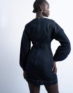 Model wearing Denim mini dress with ovoid sleeve in indigo
