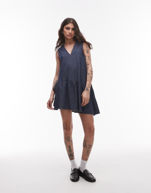 Topshop - Denim mini-jurk met peplumzoom en strikdetail in indigo met onbewerkte look