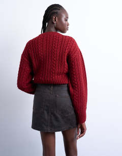 Model wearing Denim mini pelmet skirt in brown crackle