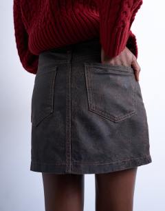 Model wearing Denim mini pelmet skirt in brown crackle