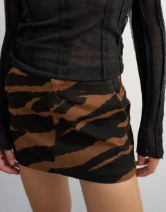 Model wearing Denim mini skirt in zebra