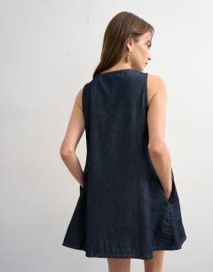 Model wearing Denim mini v -neck shift dress in indigo rinse