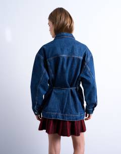 Model wearing Denim oversized dad jacket with belt tie in indigo