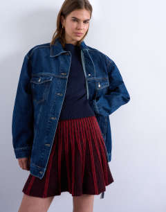 Model wearing Denim oversized dad jacket with belt tie in indigo