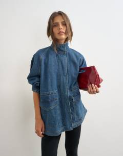Model wearing Denim oversized jacket with elasticated waist detail in mid blue
