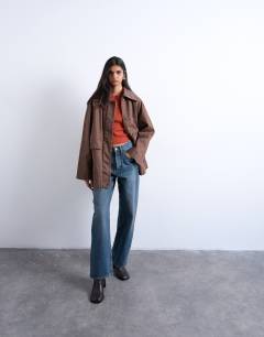 Model wearing Denim oversized waxed jacket in brown