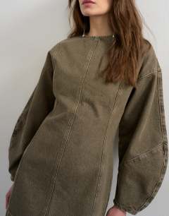 Model wearing Denim ovoid sleeve mini dress khaki