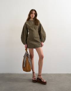Model wearing Denim ovoid sleeve mini dress khaki