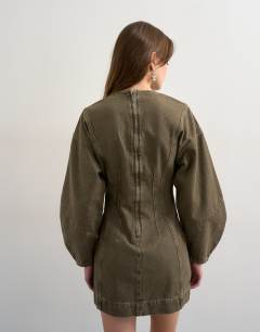 Model wearing Denim ovoid sleeve mini dress khaki