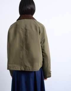 Model wearing Denim padded barn jacket with contrast cord collar in khaki